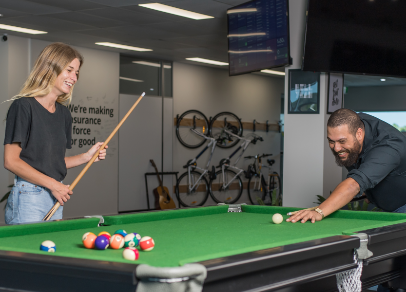 two people playing pool