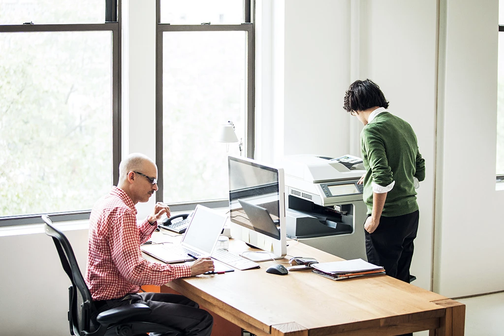 Medical Practice Employee Uses Office Ally on Laptop in the Office