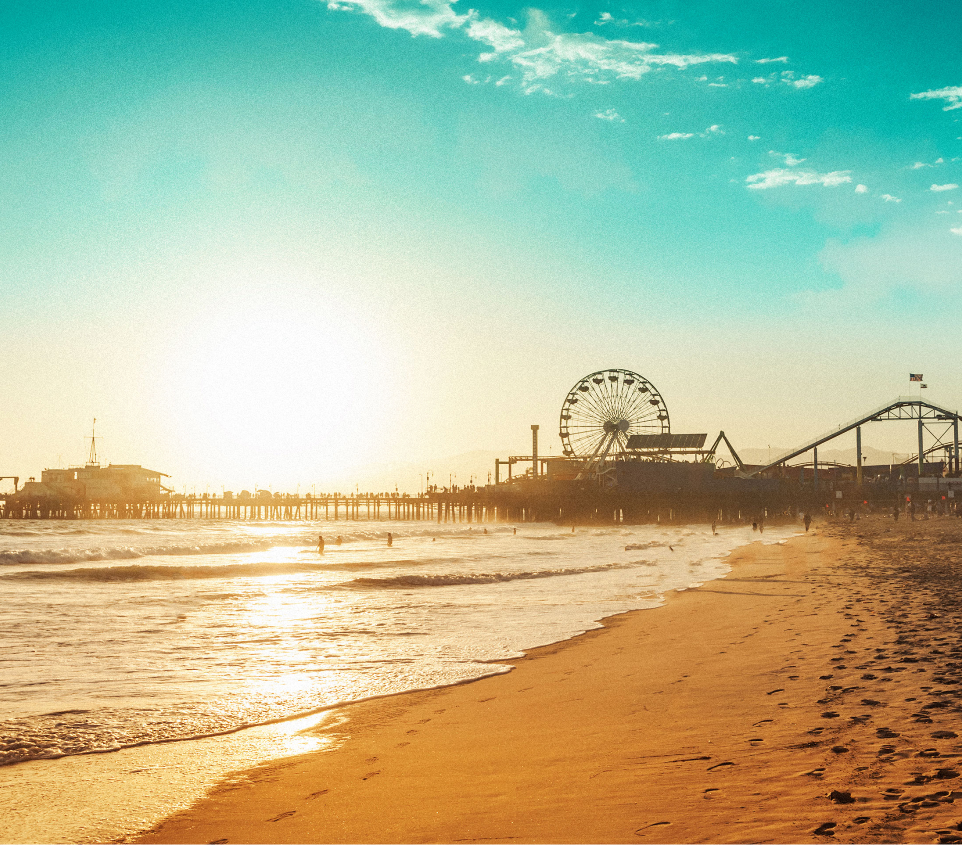 Santa Monica Pier with ferris wheel at sunset