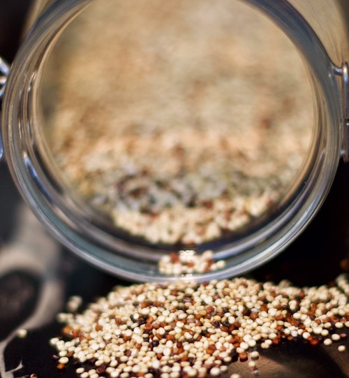 Quinoa spilling out of jar