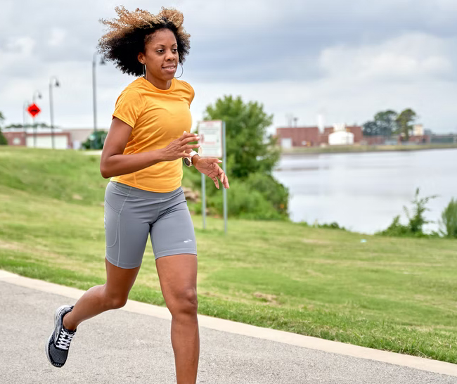 Woman running on an urban path during the day