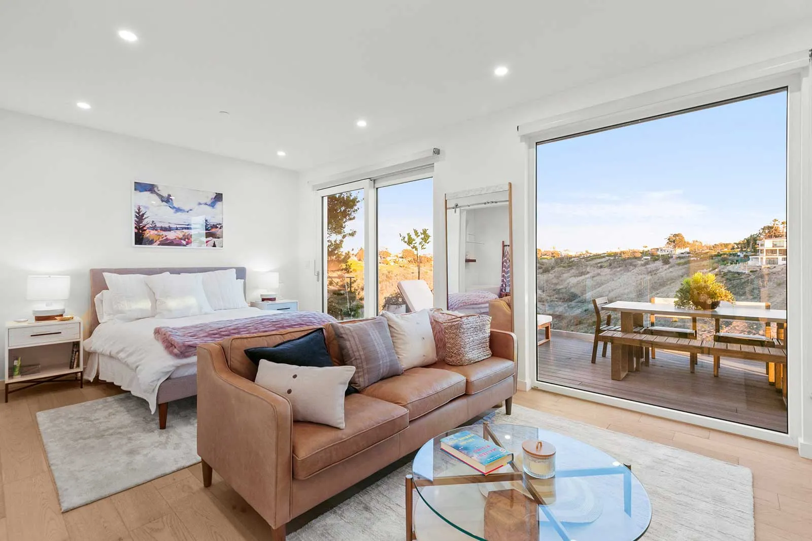 Large modern windows inside a primary bedroom of a high performance prefab home.