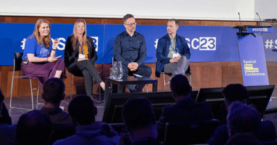 A picture of people speaking on a a panel at the Spatial Data Science Conference.