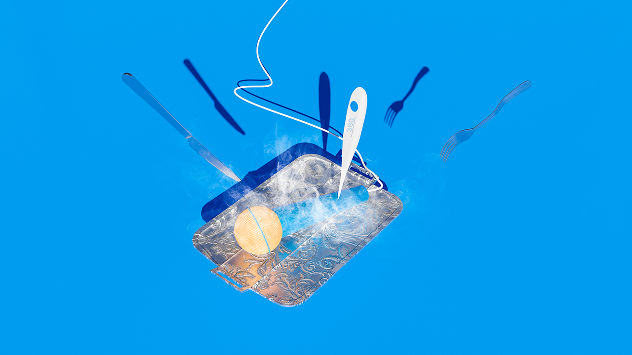Microphone with steam coming out on a serving tray with a thermometer, knife, and fork