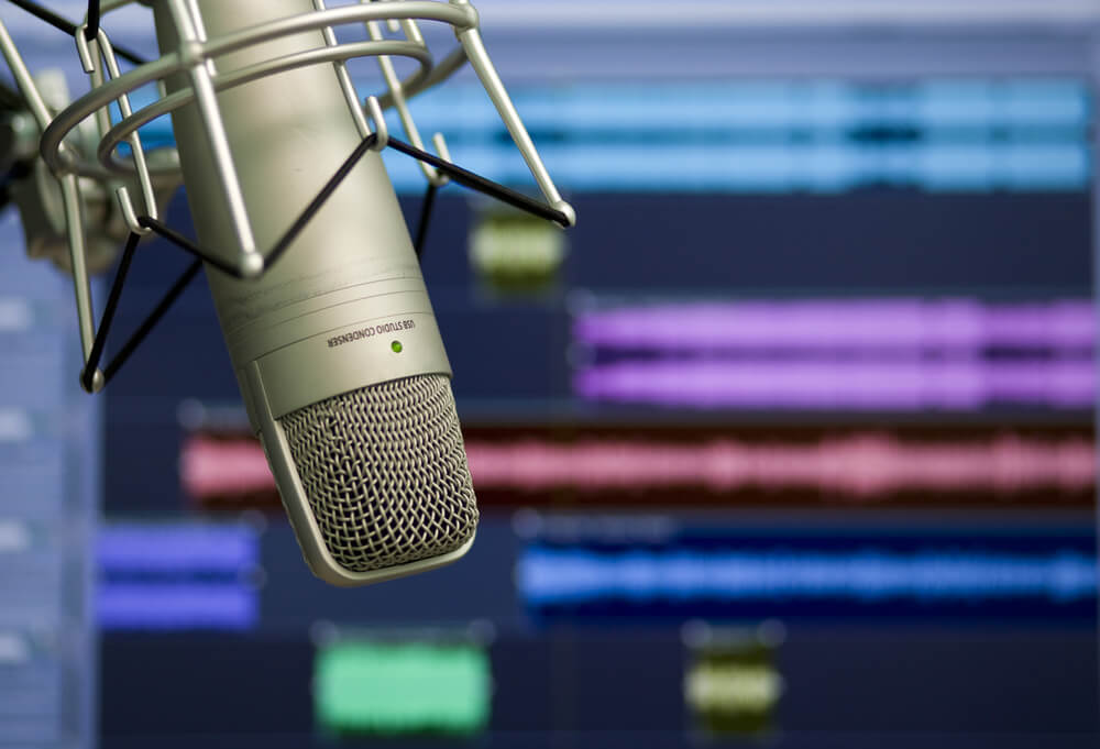 https://assets-global.website-files.com/634e7aa49f5b025e1fd9e87b/65203a321ab32b15b8945580_studio_microphone_with_sound_concept_background.jpeg