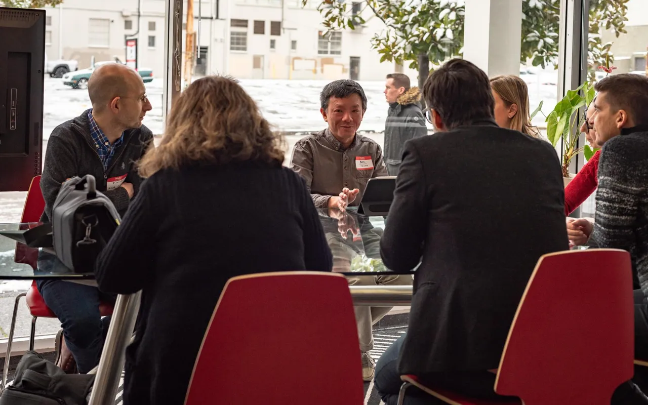 Group of local leader sitting at table in discussion
