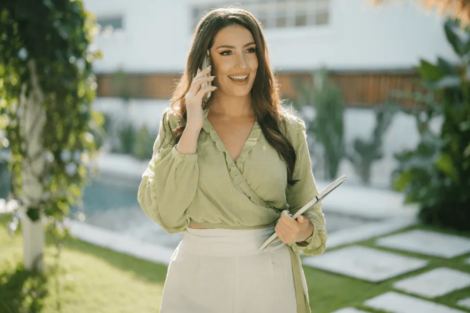 Alisha Conlin-Hurd smiling while talking someone on the phone