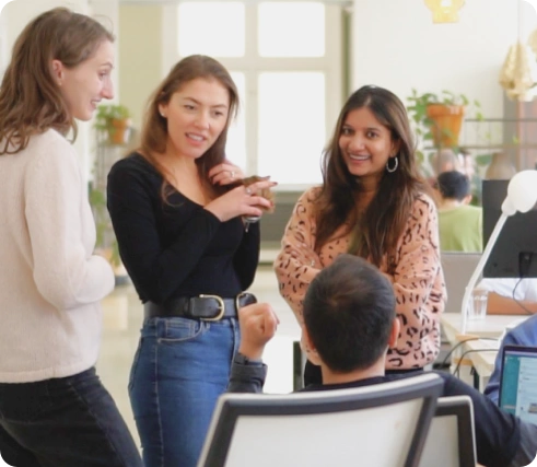 Smiling employees talking each other