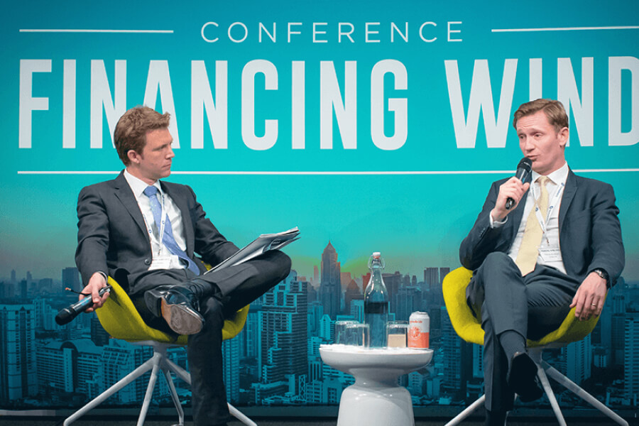 Speakers at a Financing Wind event.