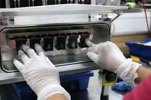 EBP employee testing inkjet cartridges