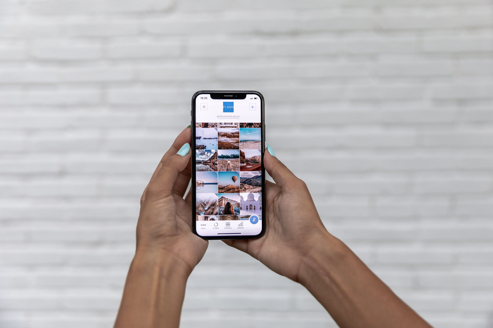 A photo of a person viewing a photo gallery on a smartphone
