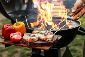 Picture of flames on an outdoor grill.