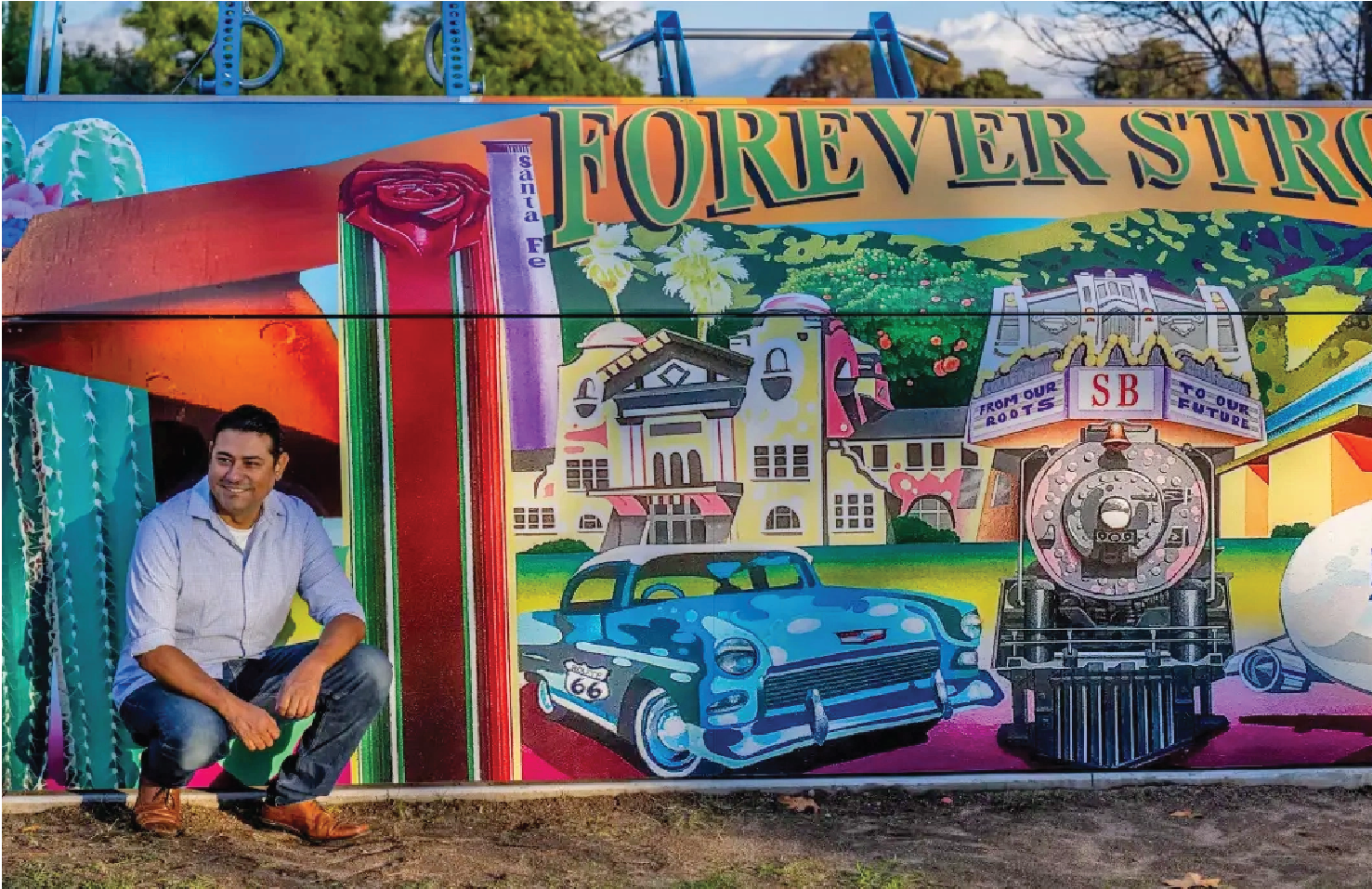 image of artist in front of their work on the Fitness Court