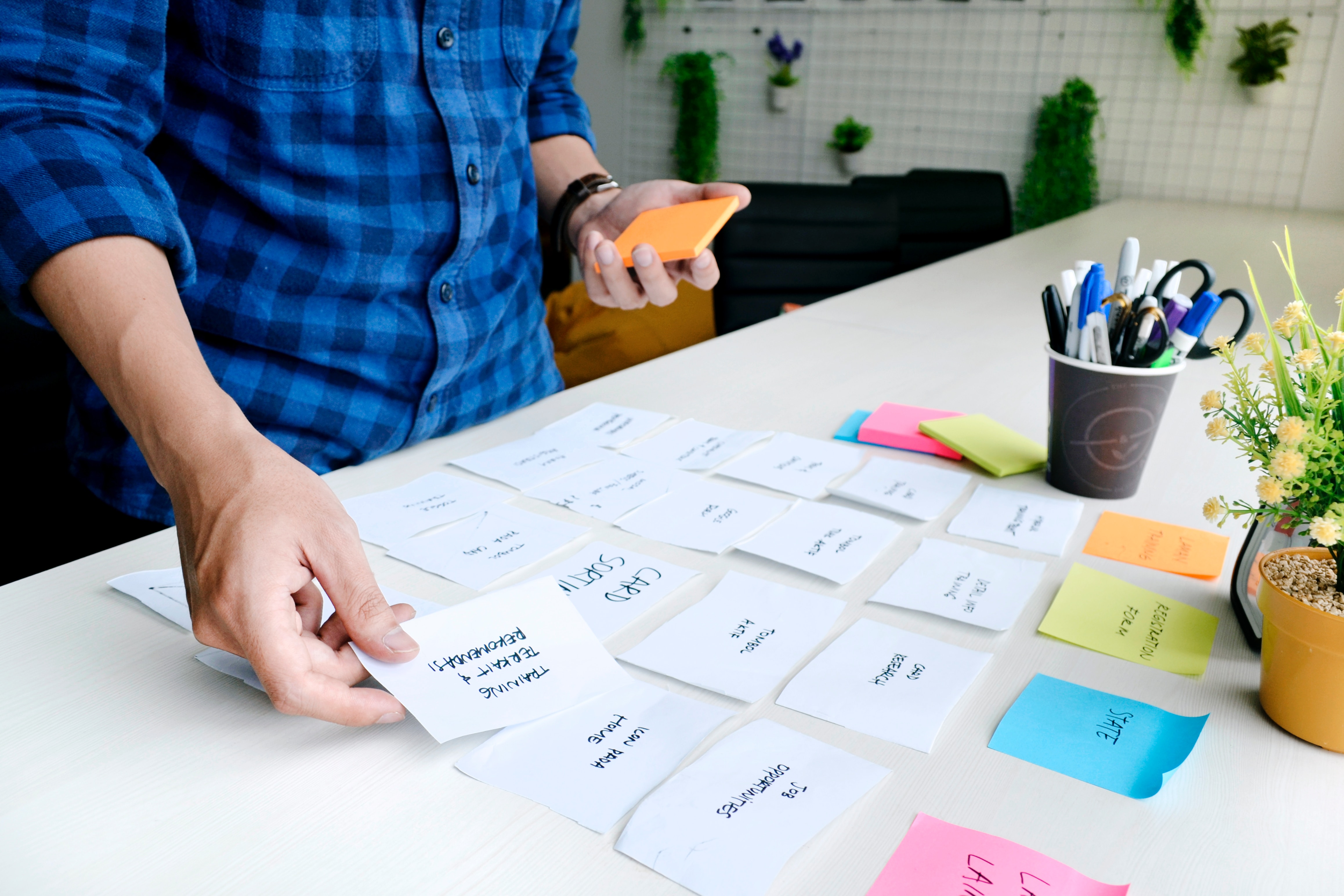 man taking out notes for release management process flow