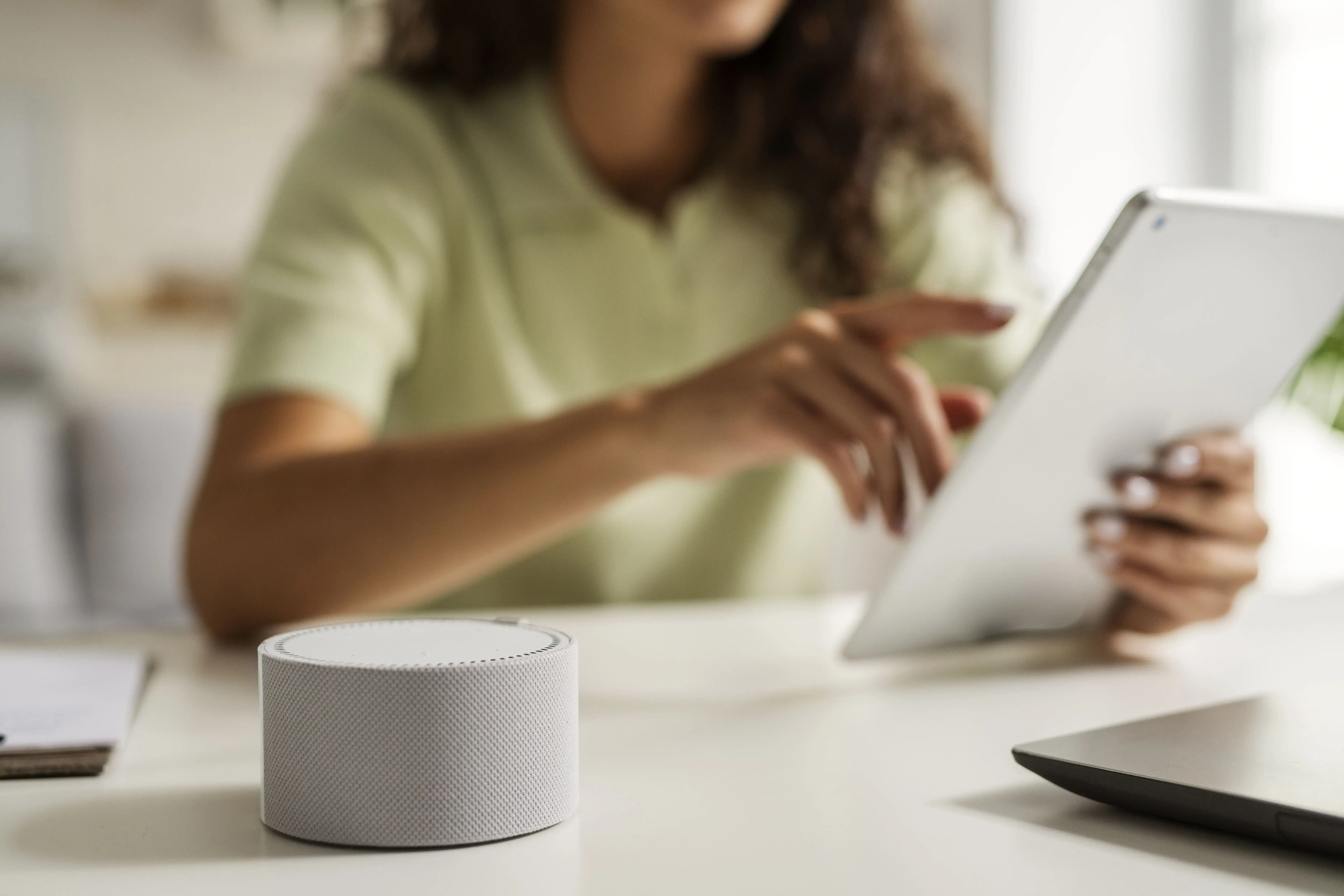 A woman using IoT devices