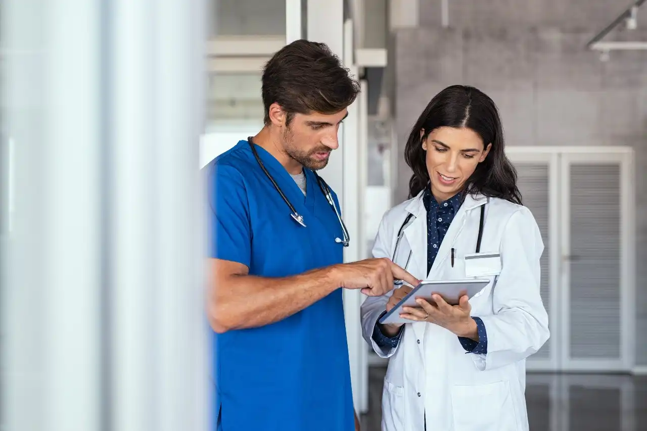 Nurse And Physician Collaboration Working Together In Healthcare