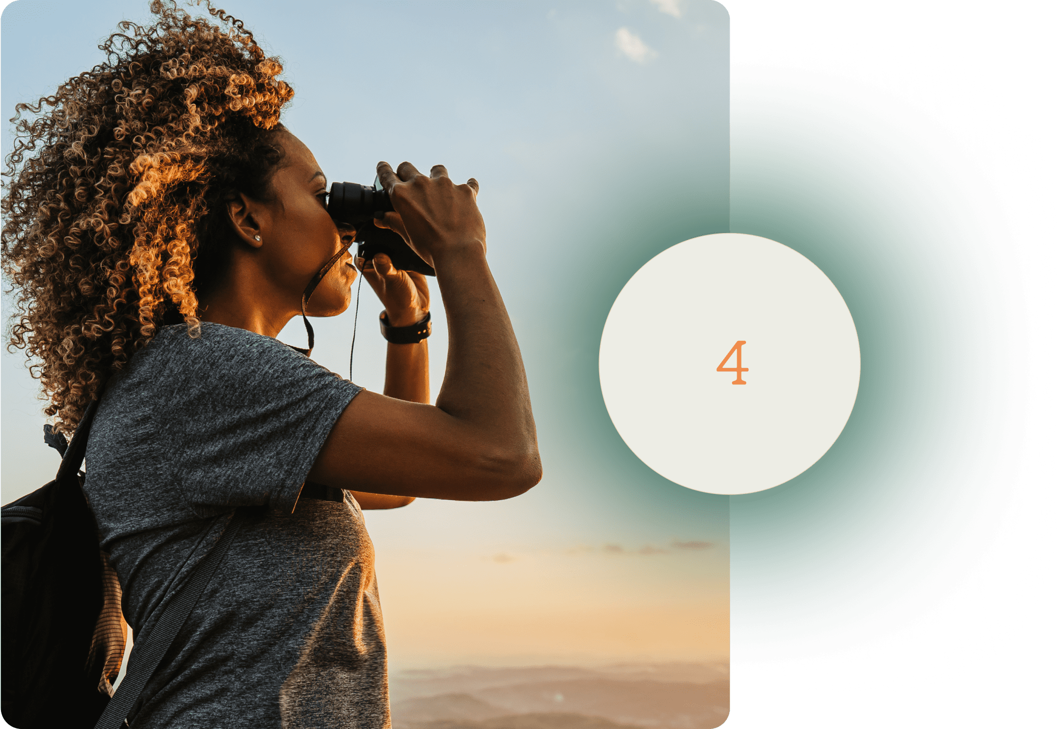 A woman looking out at mountains with binoculars.