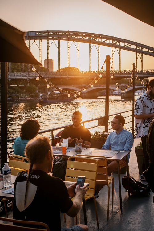 a beautiful image of sunset and water with a bridge in the background