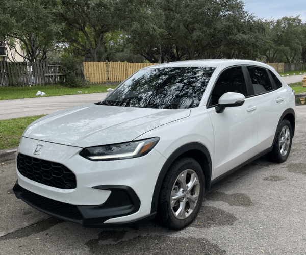 A white used Honda HR-V in an neighborhood. 