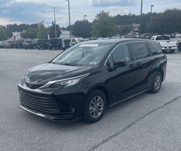 A used black Toyota Sienna Hybrid in a parking lot