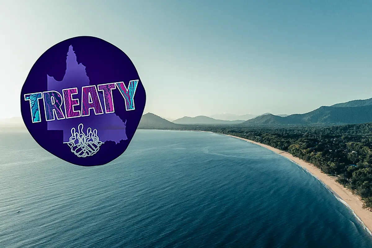 Photograph of a drone shot of Palm Cove Beach in Cairns. The ocean meets a long stretch of beach with mountains in the background. A circular graphic sits in the top left corner with the text: Treaty. 