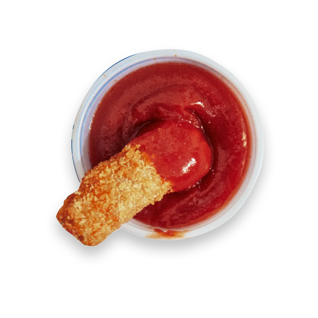 breaded cultivated meat strip in sauce