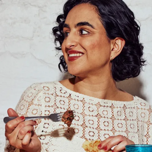 a woamn enjoys her cultivated meat