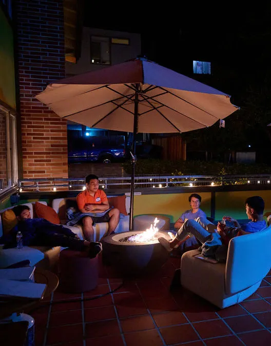 Fellows talking by the firepit