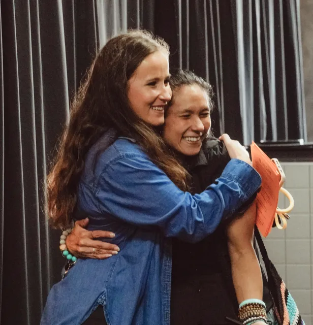 Two church members hugging each other at Vortex Church in Albemarle, North Carolina