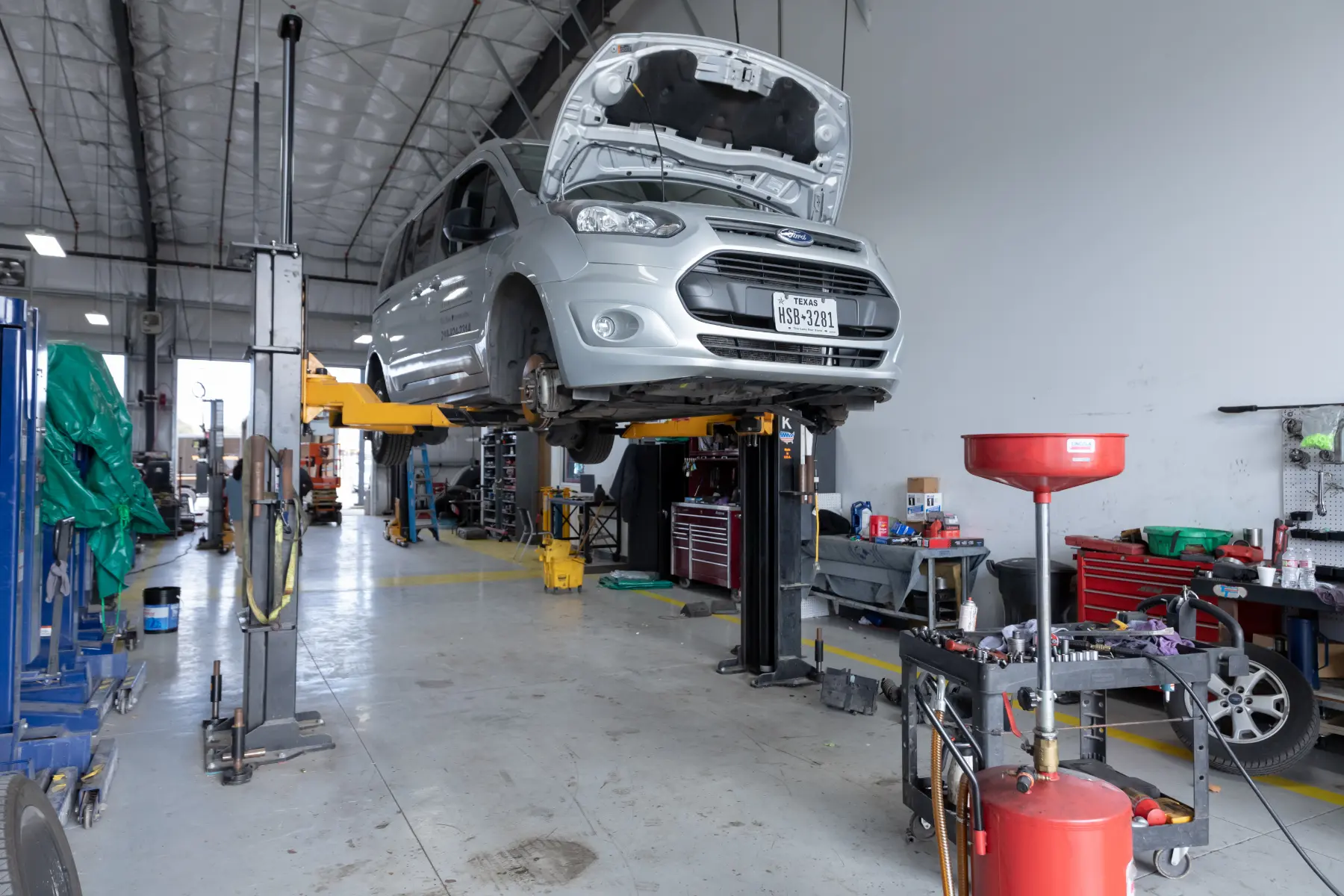 Mechanic performing auto repair services in San Antonio, Texas