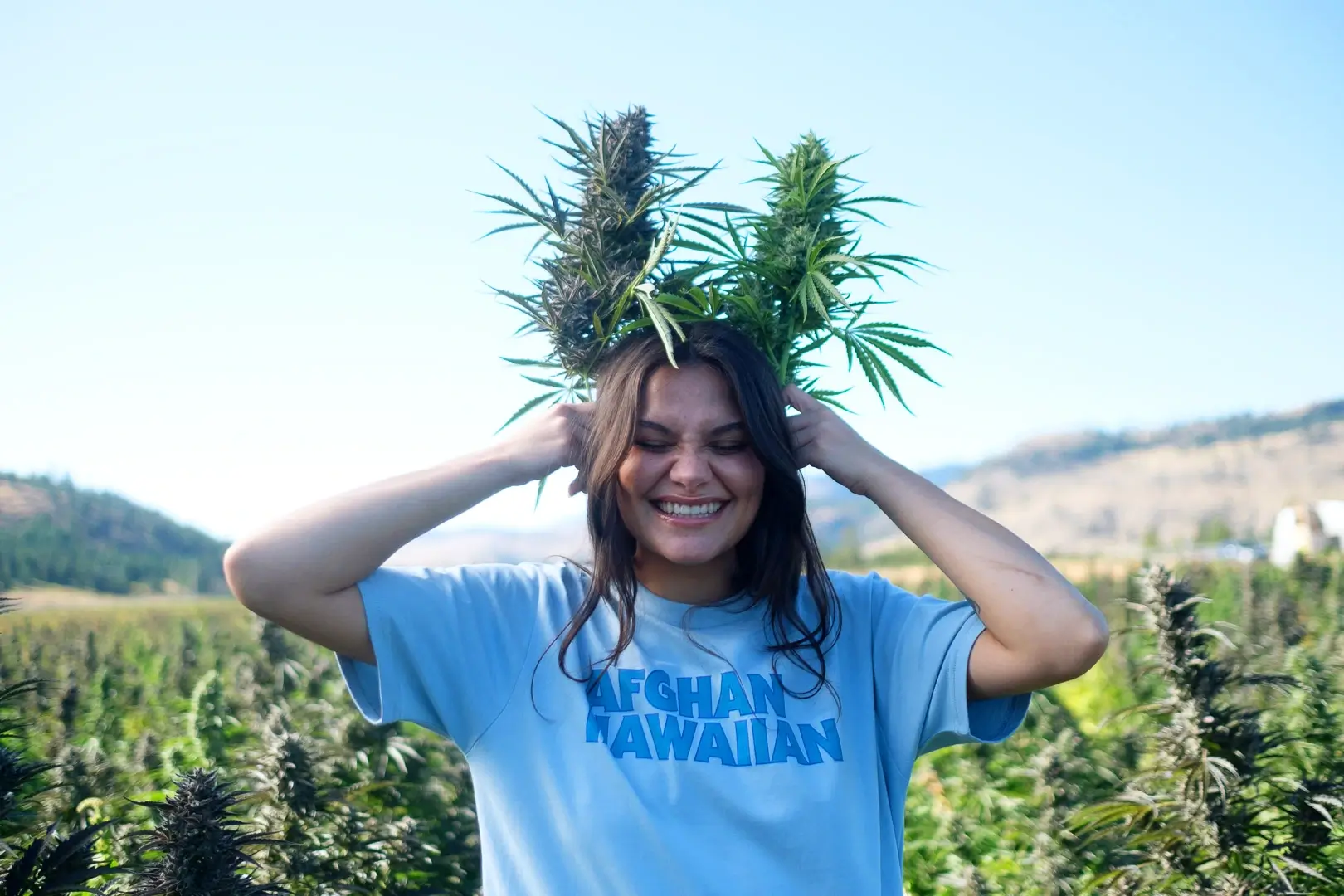 young woman put plant on her head