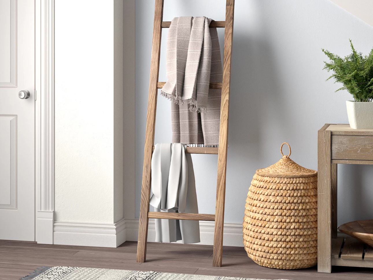 Wooden blanket ladder with blankets.