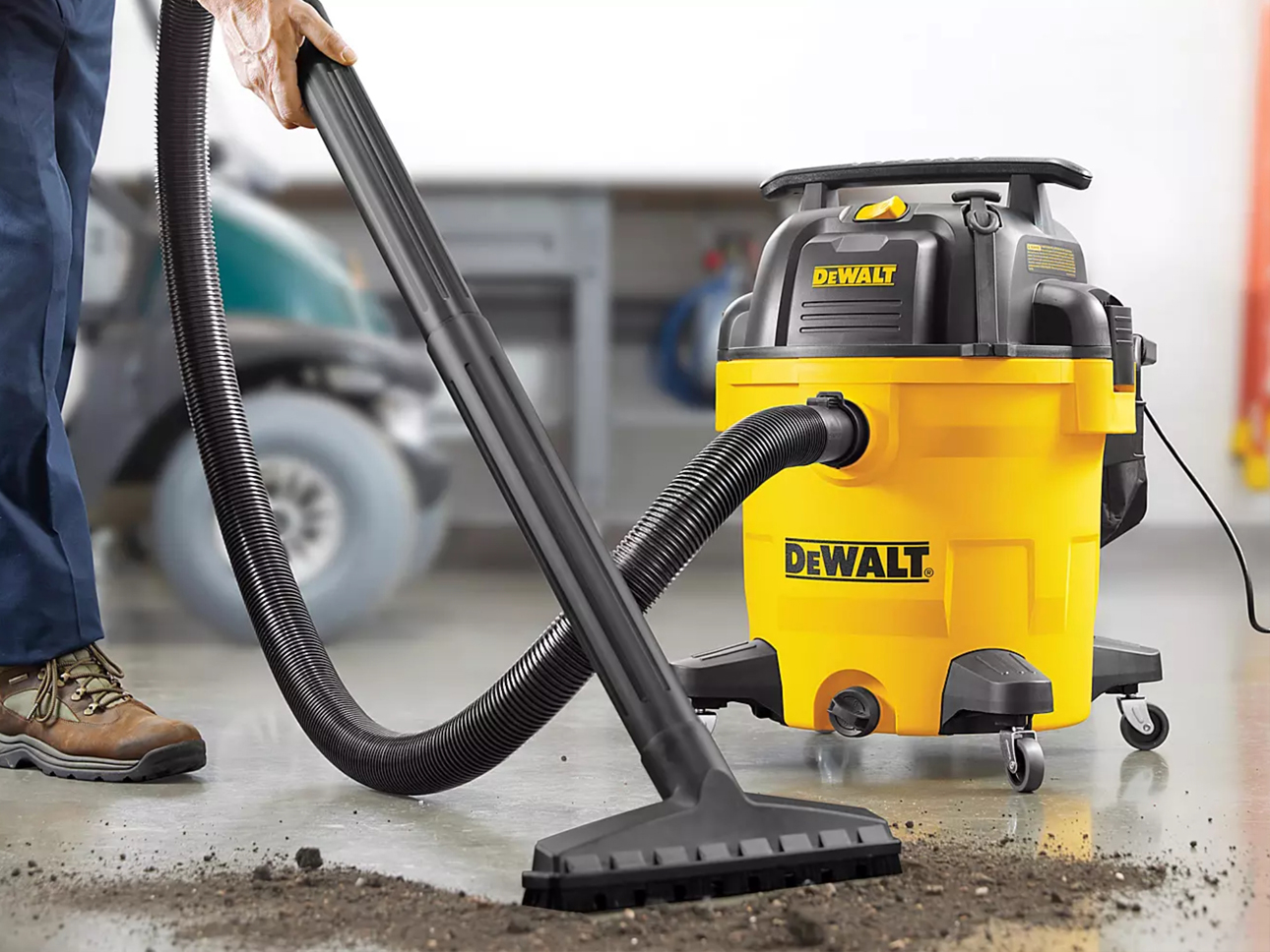 DeWalt vacuum cleaning the floor. 