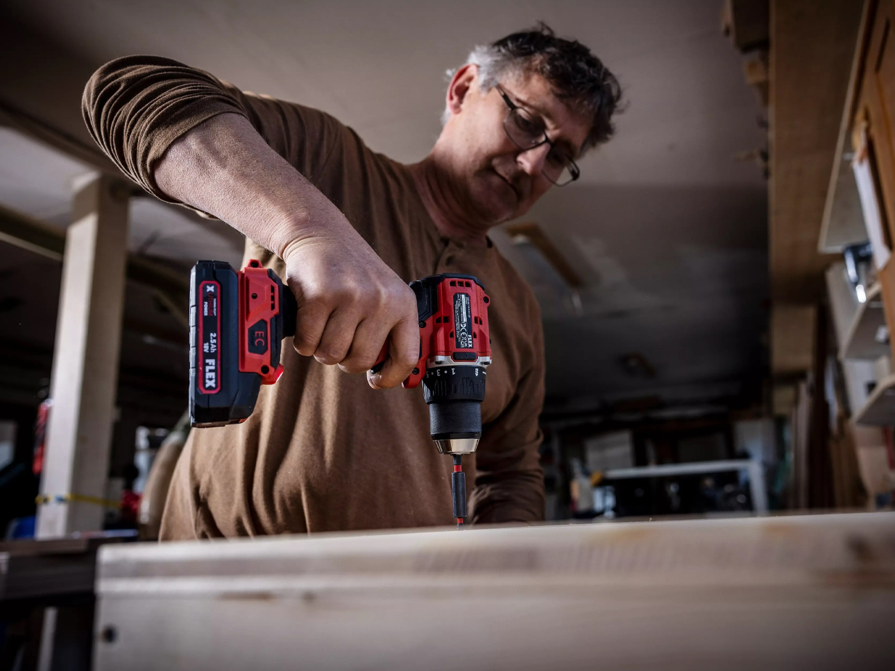 Flex power tool drilling into wood. 