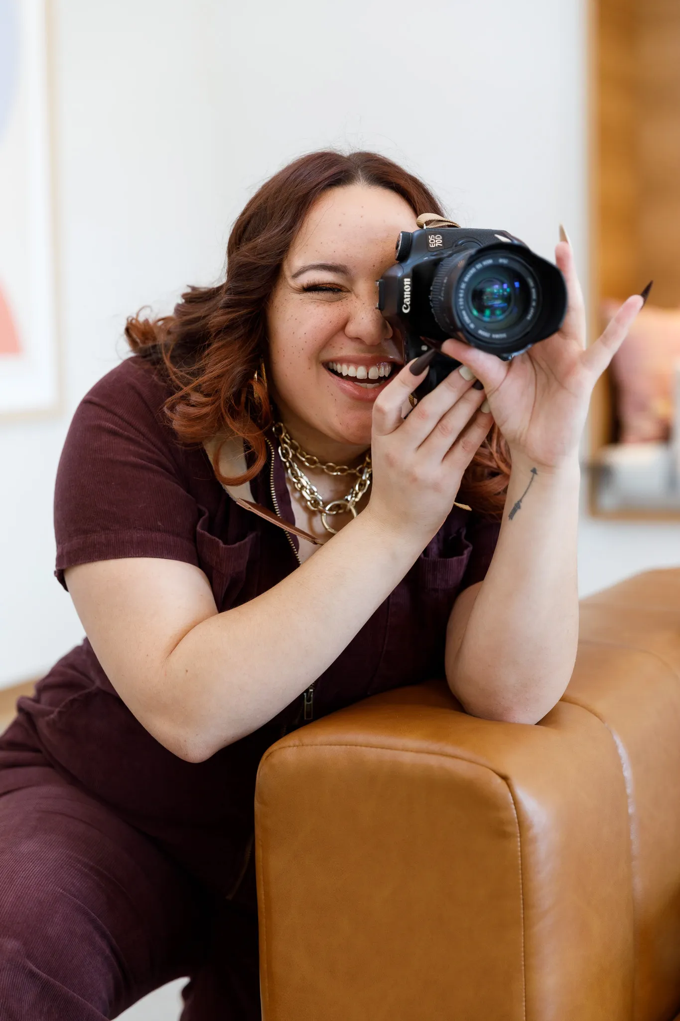 Photo of Clarke Sanders taking a photo with her camera