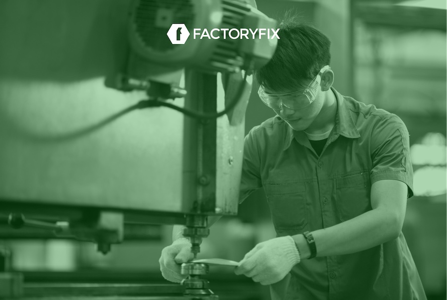 A Press Brake Operator using a hydraulic press in a factory.