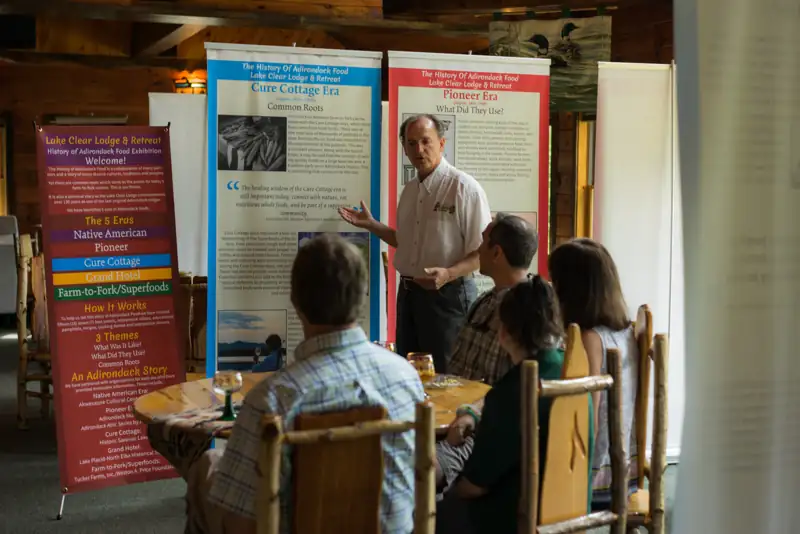 Guests watch Ernest Hohmeyer provide a presentation on the History of Adirondack Food.