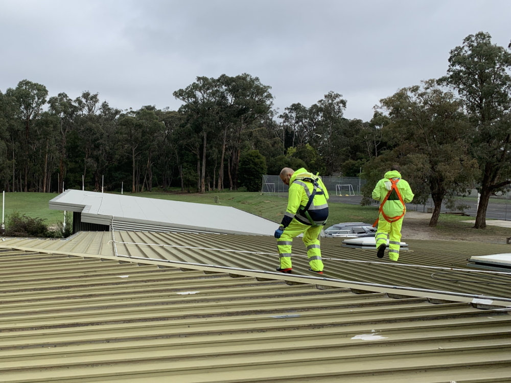 How much will it cost to repaint my commercial roof? Avello Group