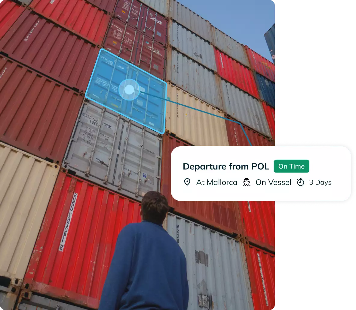 Photo of a man standing in front of containers and banner from Portcast Container Tracking Platform saying that container has departured from POL.