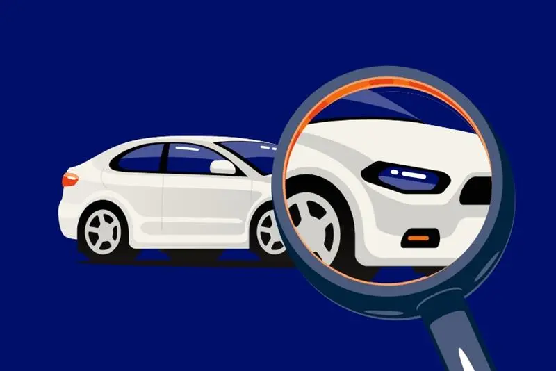 Magnifying glass searching for a car's Vehicle Identification Number (VIN) 