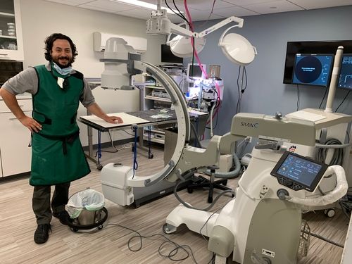 Skan-C in procedure room with happy customer