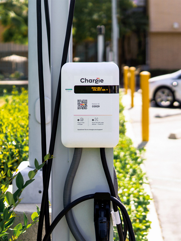 A Chargie L2 Pedestal charger stationed at outdoor parking lot.