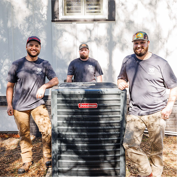 The Lawson HVAC team around an HVAC unit
