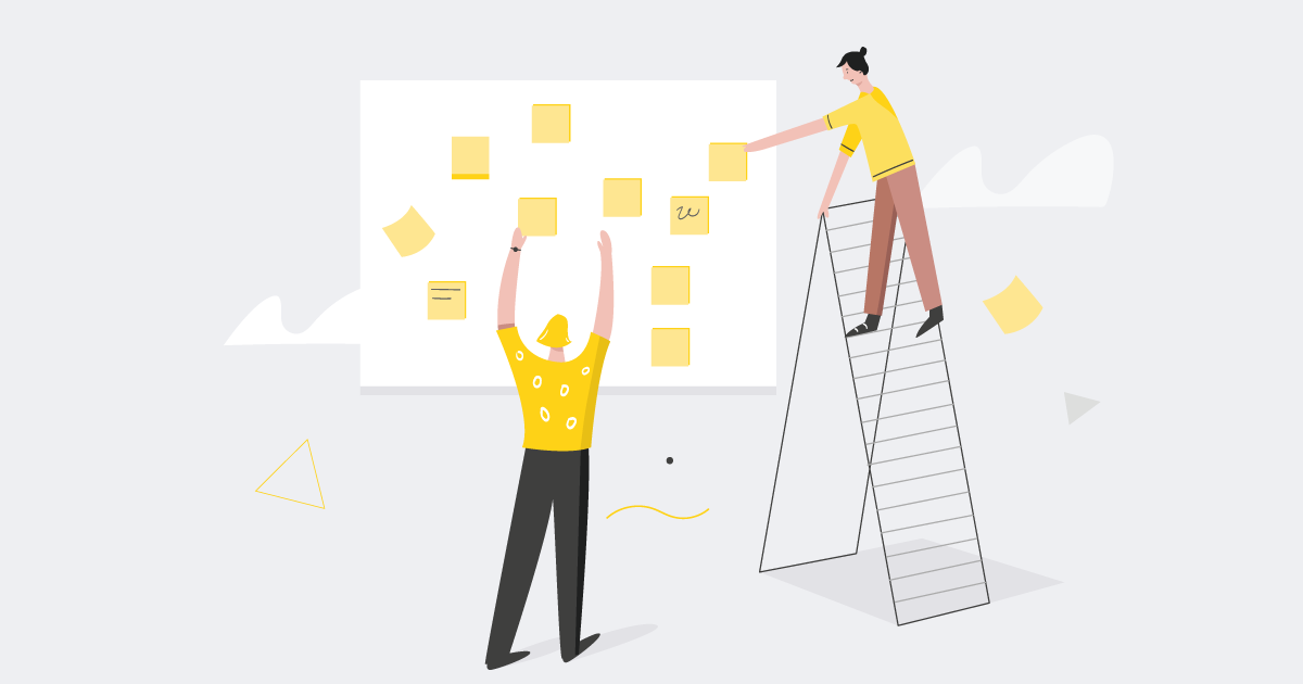 people sticking post it cards on the board