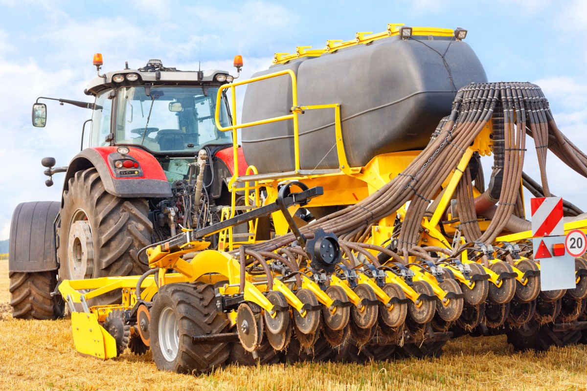Image containing sky, open air, tractor, wheelAutomatically generated description