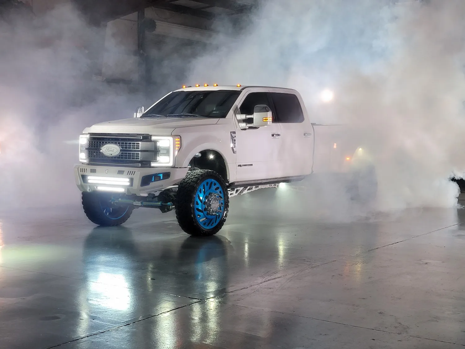white truck displayed at the bigg boy auto and marine shop