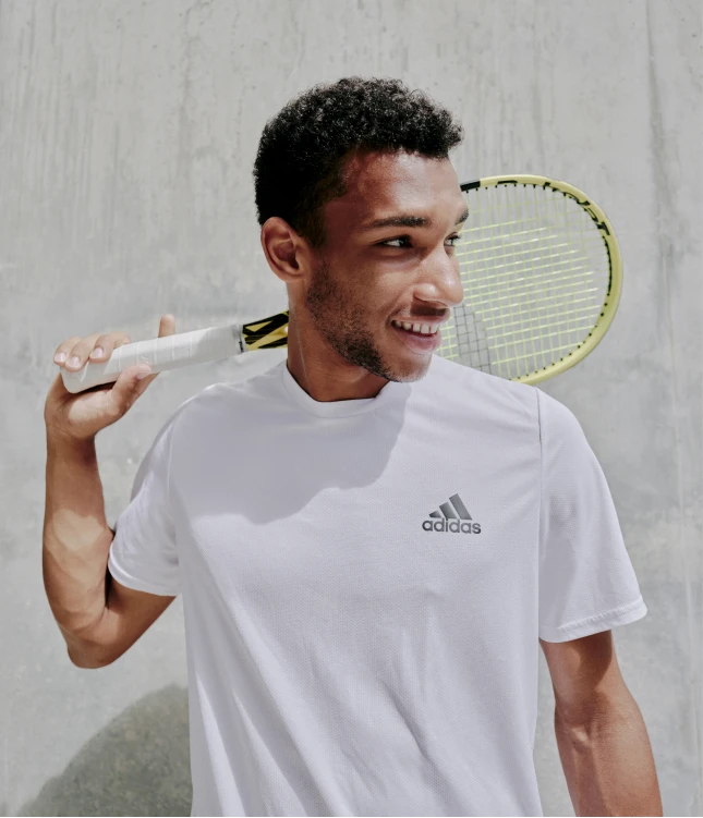 A tennis player holding a yellow racket on the cover of Macleans Magazine