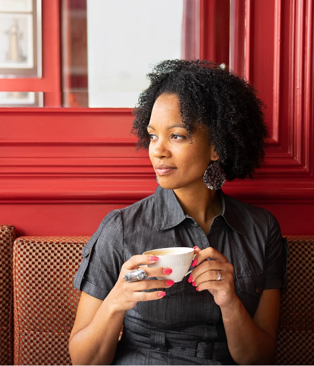 A woman drinking coffee in a coffee shop for Canadian Business Magazine
