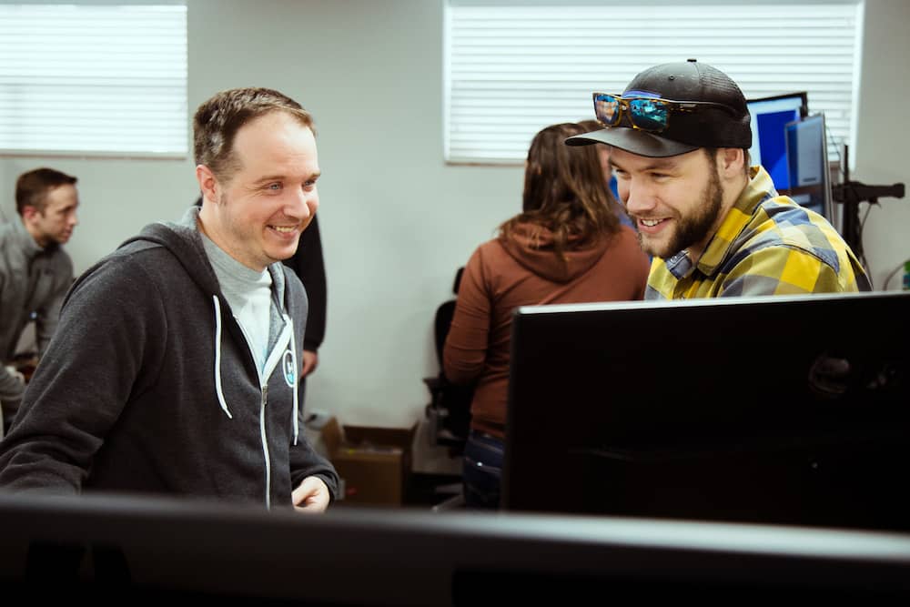 developers pair programming at desk