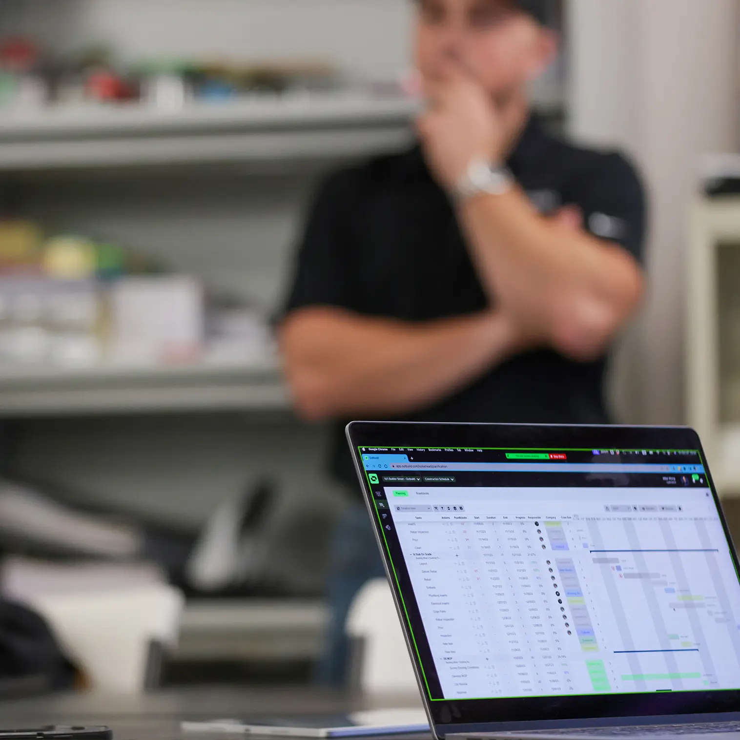 Computer at the job site using Outbuild's construction scheduling and planning software